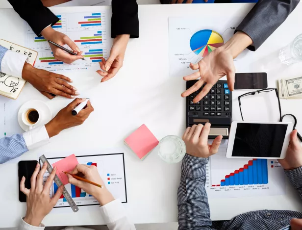 businessmen-hands-white-table-with-documents-drafts